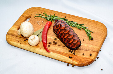 Tasty sausages and vegetables isolated over solid background
