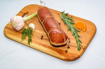 Tasty sausages and vegetables isolated over solid background