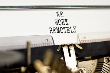 We work remotely symbol. Concept words We work remotely typed on beautiful retro old typewriter. Beautiful white background. Business we work remotely concept. Copy space.