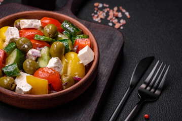 Delicious fresh, juicy Greek salad with feta cheese, olives, tomatoes, cucumber