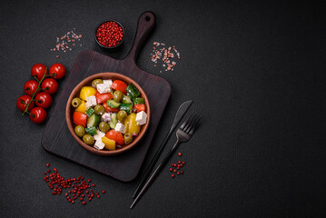 Delicious fresh, juicy Greek salad with feta cheese, olives, tomatoes, cucumber