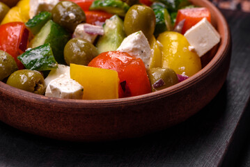 Delicious fresh, juicy Greek salad with feta cheese, olives, tomatoes, cucumber