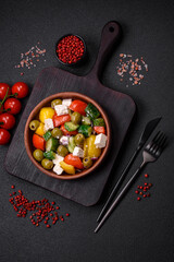Delicious fresh, juicy Greek salad with feta cheese, olives, tomatoes, cucumber