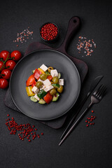 Delicious fresh, juicy Greek salad with feta cheese, olives, tomatoes, cucumber