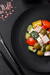 Delicious fresh, juicy Greek salad with feta cheese, olives, tomatoes, cucumber