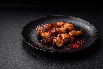 Delicious fresh, juicy chicken or pork kebab on skewers with salt and spices