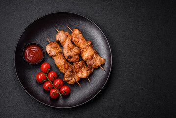 Delicious fresh, juicy chicken or pork kebab on skewers with salt and spices