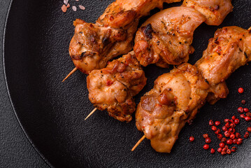 Delicious fresh, juicy chicken or pork kebab on skewers with salt and spices