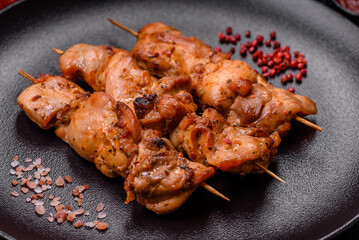 Delicious fresh, juicy chicken or pork kebab on skewers with salt and spices