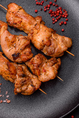 Delicious fresh, juicy chicken or pork kebab on skewers with salt and spices