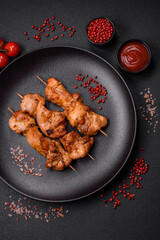 Delicious fresh, juicy chicken or pork kebab on skewers with salt and spices