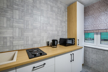 interior of the modern luxure kitchen  in studio apartments with cupboard