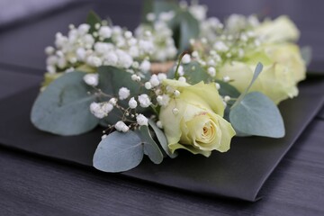 Selective focus of the beautifully decorated white rose for a special ceremony on a black background