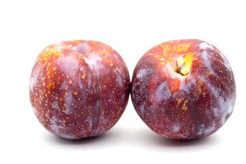 Organic red plums fruit .Closeup of Plums isolated on white background.