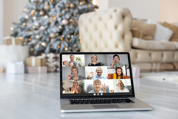 Family video call by remote chat laptop computer screen on Christmas holiday background. Xmas online virtual family party celebration, Happy New Year videocall.