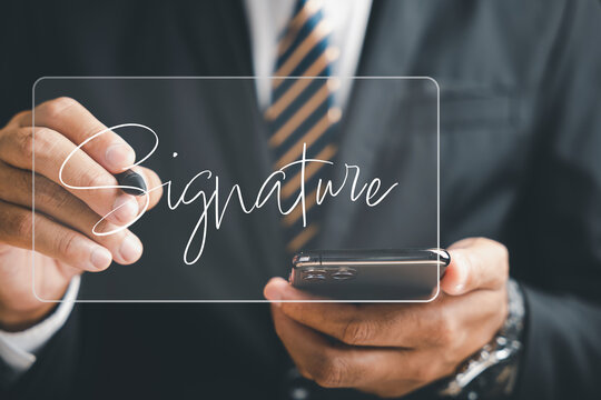 Businessman embraces digital transformation, signing electronic documents on virtual screen with smartphone. Highlights electronic signature, e-signing on black background. Agreement is confirmed.