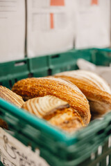 Crusty fresh sourdough loaves in bakers crate ready for delivery