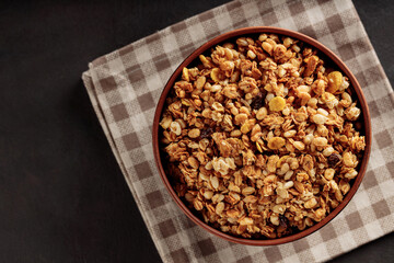 Wholesome Morning Delight: Close-Up of Granola in a Bowl on Linen Napkin