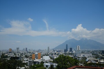 Obraz premium Skyline of Monterrey with Cerro de la Silla mountain in the background. Mexico.