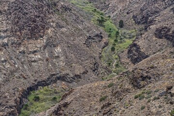 Obraz premium Scenic view of barren rock formations in a canyon