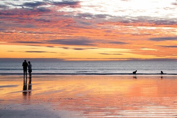Closeup of a beautiful sunset above a body of tranquil water