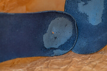Worn-out shoe insoles on paper, showing the hopeless situation of refugees trying to illegally...