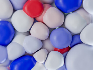 An artistic 3D composition featuring smooth stones in blue, white, and red hues. Geometric patterns blend seamlessly in this modern and abstract artwork, creating a visually captivating experience.