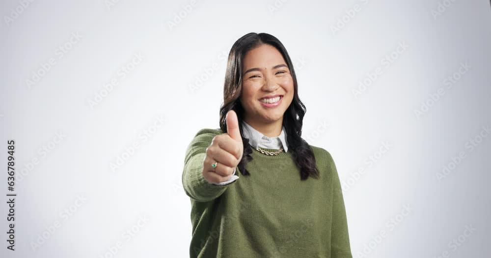 Canvas Prints Thumbs up, woman and portrait, agreement and hand, gesture with support isolated on white background. Asian, yes and like emoji with opinion, vote and thank you, review and feedback in a studio