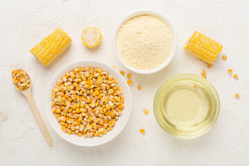 Maize products with fresh corn cobs on concrete background, top view