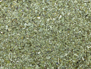Dry mate tea close up. Pile of mate tea leaves top view. dried and crushed leaves of Paraguayan...