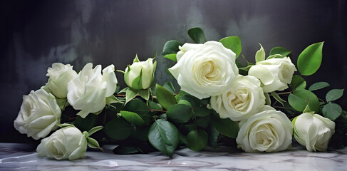 Beautiful white flowers, roses, over marble background. Bouquet of flowers at cemetery , funeral concept.