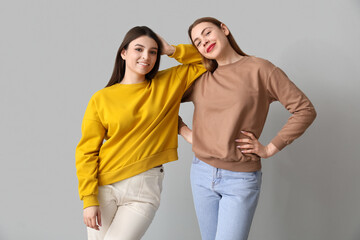 Female friends on light background