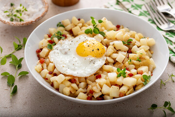 Potato hash with pancetta topped with a fried egg