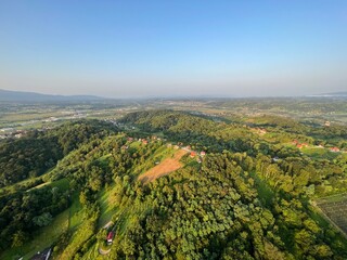 Fototapeta premium View of forests, fields, villages and Zagorje hills, during a panoramic balloon flight over Croatian Zagorje - Croatia (Panoramski let balonom iznad Hrvatskog zagorja - Hrvatska)