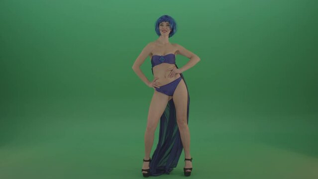 Girl with blue hair go go dancing on green screen