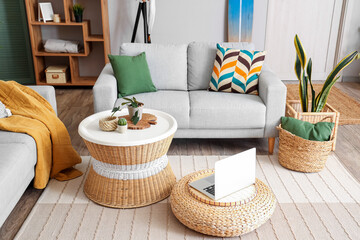 Interior of stylish living room with surfboard