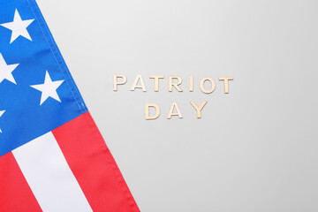 Wooden inscription in memory of National Day of Prayer and Remembrance for the Victims of the Terrorist Attacks on grey background