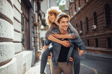 Young mixed couple walking and exploring the city
