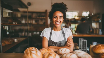 Fotobehang Bakkerij Black woman working at a bakery shop