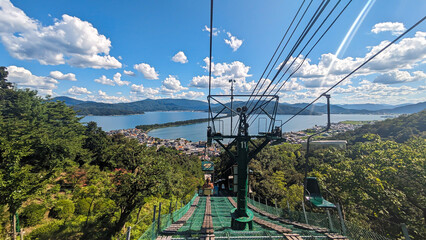 Lift attraction in beautiful mountain and beach nature view with blue sky