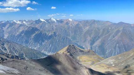 Climbing Komsomolets Peak, Ala-Archa National Park, Kyrgyzstan. View from the height of the Kyrgyz mountains.