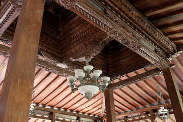 Fototapeta na wymiar ancient Javanese hanging lamps on building roofs and carved ceilings typical of ancient Indonesian Javanese