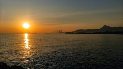 sunrise near Paiton steam power plant and Baluran mountains, Probolinggo, East Java, Indonesia