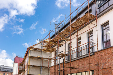 Obraz premium facade of old building with scaffold during renovation works.