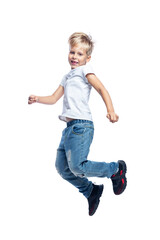 Laughing boy jumping. Blond guy in a white T-shirt and jeans. Energy and activity. Full height. Isolated on white background. Vertical.