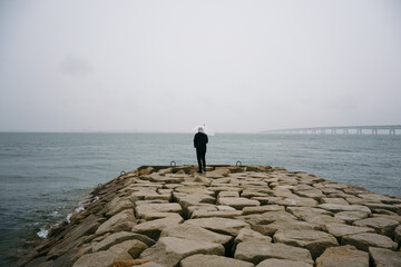 Fototapeta na wymiar man standing on the coast