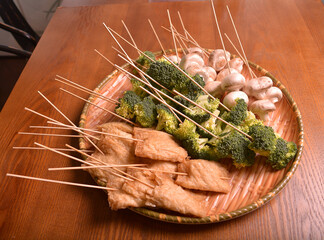 cold mixed raw meats, seafood, vegetable, mushroom, satay, beancurd, hot dog in stick for lok lok...