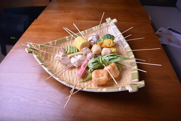 cold mixed raw meats, seafood, vegetable, mushroom, satay, beancurd, hot dog in stick for lok lok...