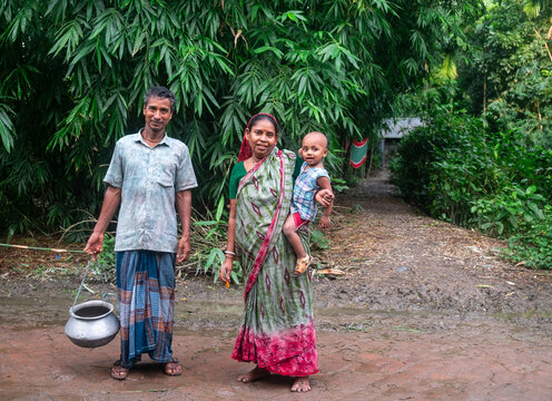 South asian hindu religious grandparents with their grandson in an outdoor park 