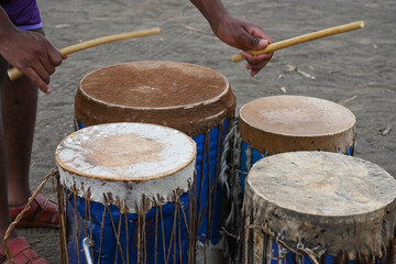 Fototapeta na wymiar African Street Musician Playing Drums